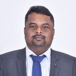 Dr._ K. _Arjunan